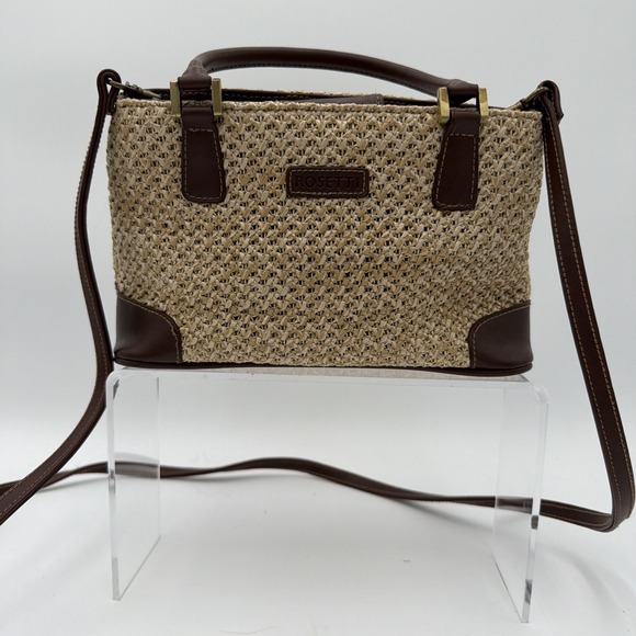 Rosetti Handbags - Rosetti straw tote handbag with brown faux leather trim and top handles.